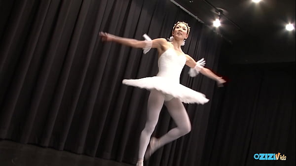 The skilled Asian dancer performs for her audience, exuding delight