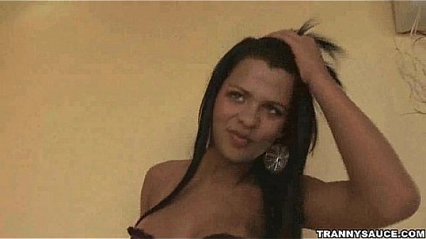 Foxy brunette tranny babe tugging on her hard cock