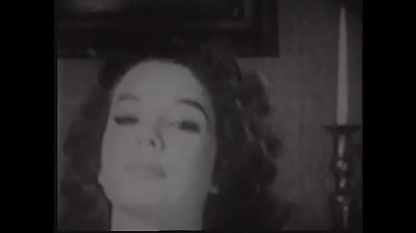 Gorgeous brunette woman in old-fashioned lingerie posing in front of the photographer