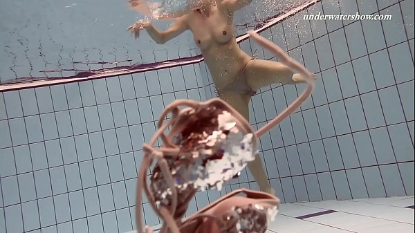 Tight shaved pussy swims naked in the pool