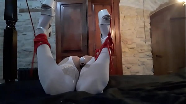 Laura on Hee step sister bound on a bed in white catsuit vibed and deepthroat a large cock.  