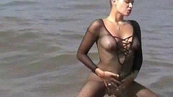 young innocent brunette plays outside at the beach