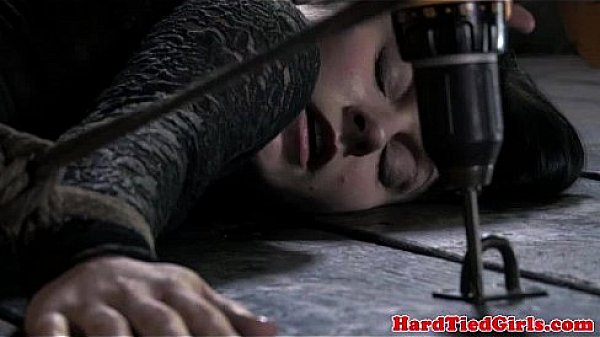 Brunette restrained to floor and whipped