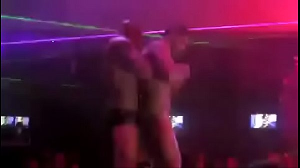 Gay strippers dancing and kissing together