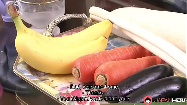 Yummy Japanese slut lies on a couch with her legs spread open. Her kinky lover inserts vegetables deep down her wet pussy.