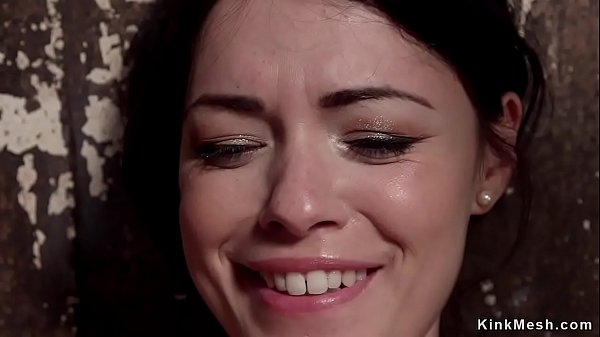 Gagged brunette slut in standing bondage gets tormented