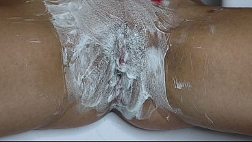 Shaving a pussy with a trimmer and a razor! Closeup!