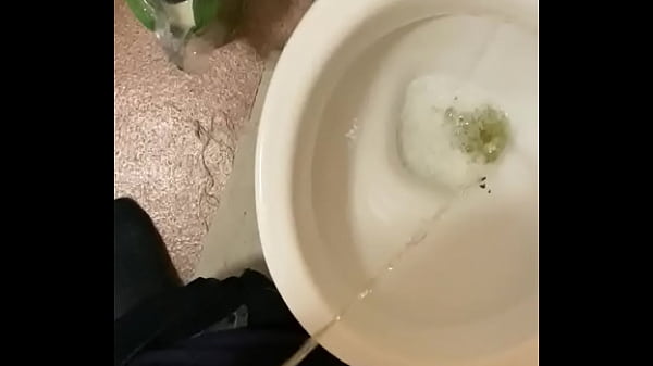 Taking a piss in the toilets playing with my dick