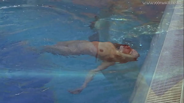 Big tits and ass Lina swims naked in the pool  