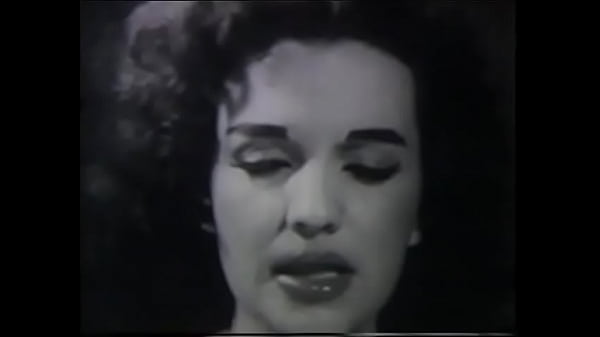 Curly babe shows her nice tits in black and white shots