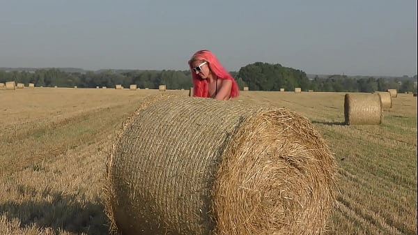 Bikini, hay rolls and field