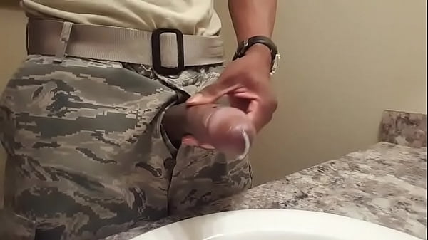 Black soldier wanking in the bathroom
