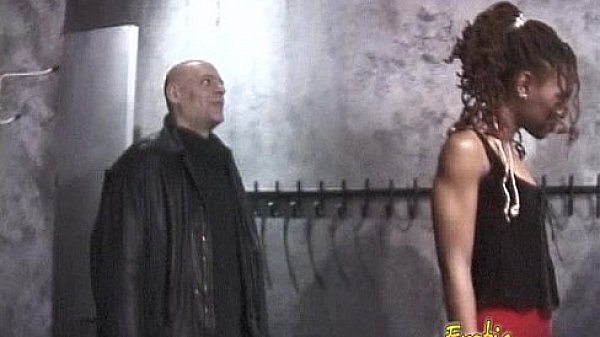 Slim ebony dominatrix pleasures a horny dude in the dungeon