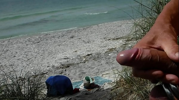 Masturbating at a public beach. Shooting a big load.