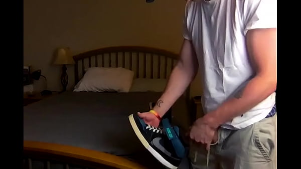 Skater Guy Sniffing his own Skate Shoes