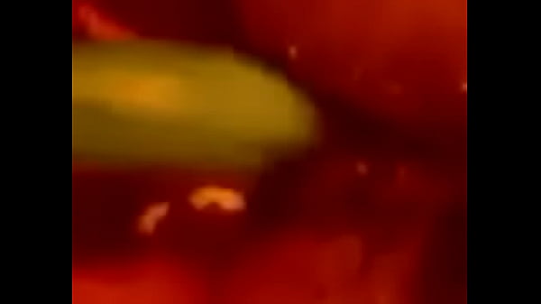 Playing with a cucumber  