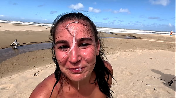 Slut giving blowjob and handjob on beach, cum facial