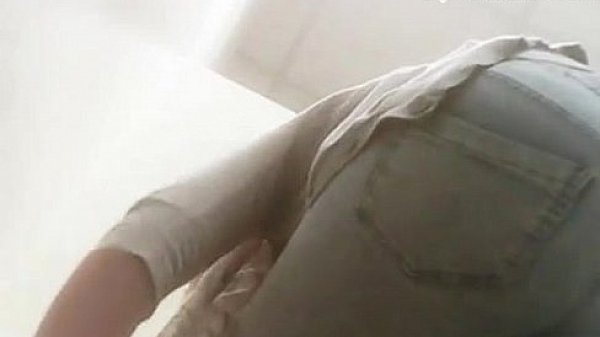 Cute chick trying on clothes in dressing room  