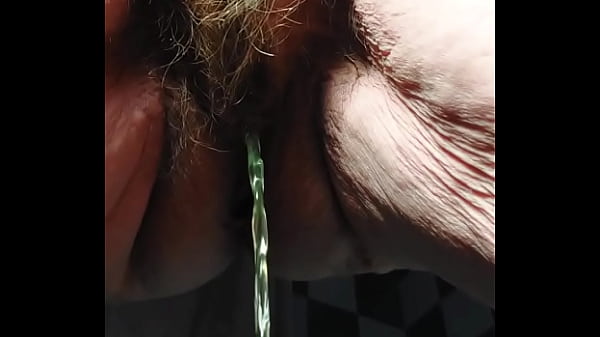 Granny peeing and using cucumber  in hairy pussy  