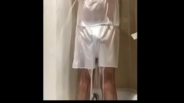 Man strips from wet tee shirt and white boxers and masturbates in the shower