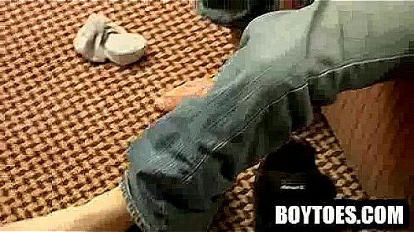 Amateur stud rubbing his feet before tugging his cock