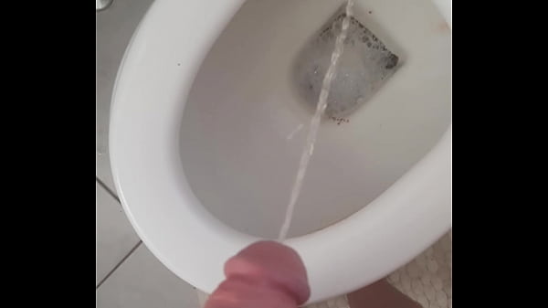 Hot t-girl taking a piss in the toilet  