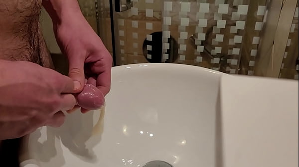 Pissing inside a used condom 