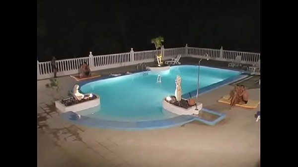 Pretty blonde babe Tiffany Rousso fills her twat by a cock near by the pool