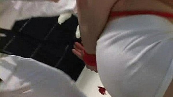 Gagged slaved in bondage is b. up inside the ring  