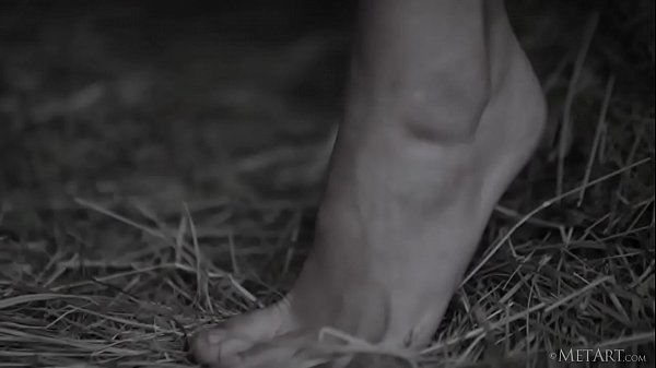 Beautiful blonde babe Tracy A removing her clothes on a straw bale  