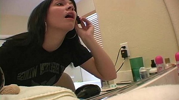 Amateur girl applying makeup