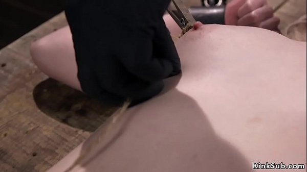 Blonde slave Violet October with pale skin in metal device bondage gets whipped 