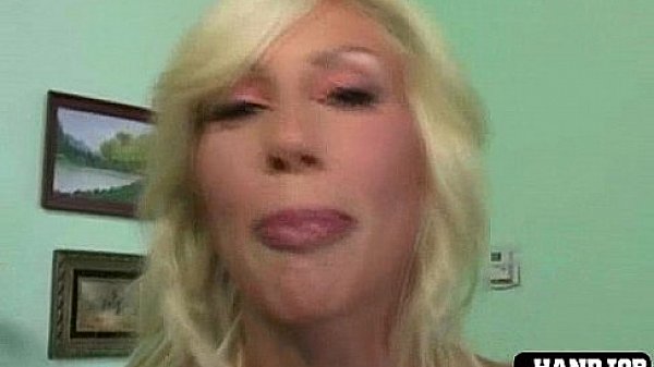 Big breasted girl jerks cock off