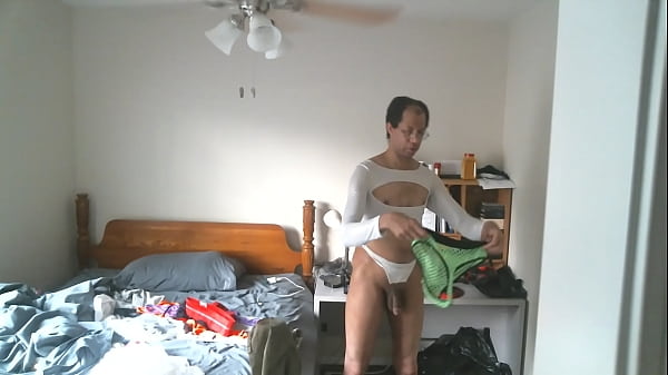 CUTE BLACK GUY DISPLAYING SISSY COSTUMES 