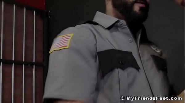 Hot footjob action in a prison jail cell