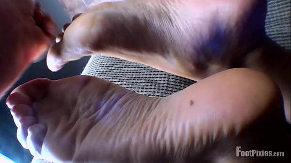 Pixie Shows Feet On Couch