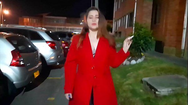 Melly goes for a walk outside her house in very sensual lingerie, walks slowly in her heels, her coat and lights a cigarette.