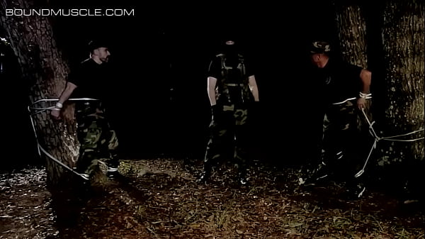 Two hot muscular men get tied up to the trees and tormented  