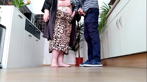 Doggystyle in the kitchen with a curvy milf with natural tits