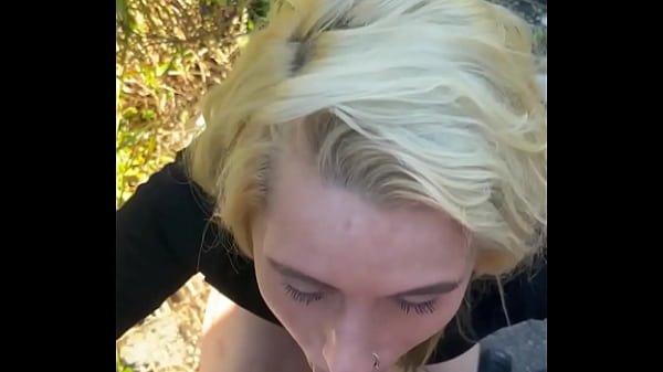 Blonde streetwalker takes a facial in public  
