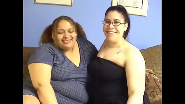 Two BBW lesbians Lulu Garcia and Nikki have fun with a strap on 