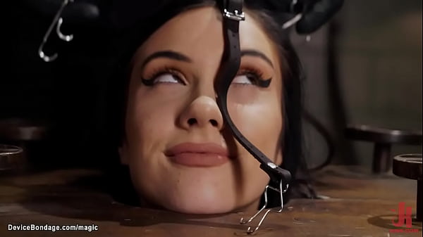 Tied and locked in bondage cube sexy skinny brunette babe Jazmin Luv gets gagged then bent over caned and fucked with dick on a stick by master The Pope  