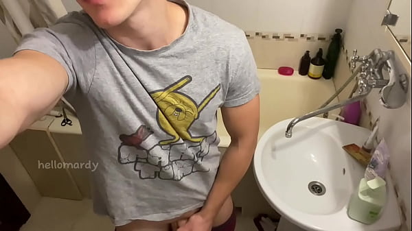 Guy jerking off cock in the bathroom 