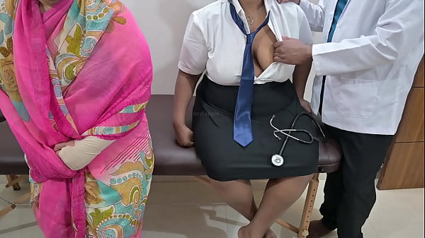 Mom watches doctor checking in clinic