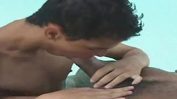 Muscled latino guy teaches his buddy how to suck it