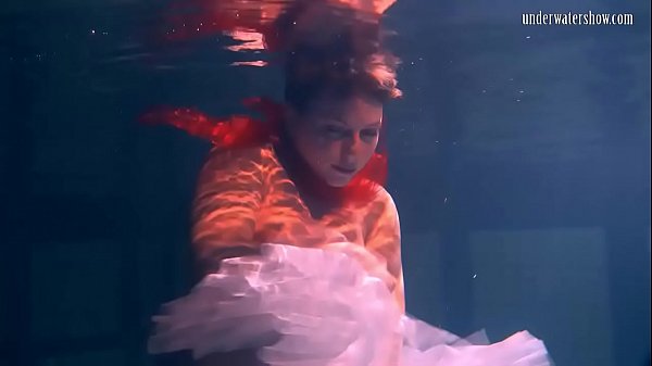 Bulava Lozhkova with a red tie and skirt underwater