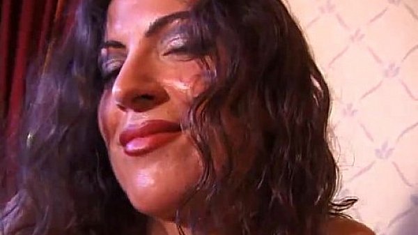 Curly brunette masturbates