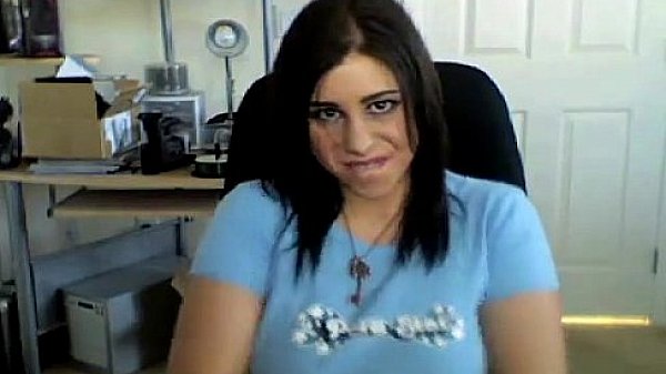 Busty latina playing with her tits