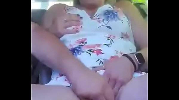 Milf plays with pussy in car