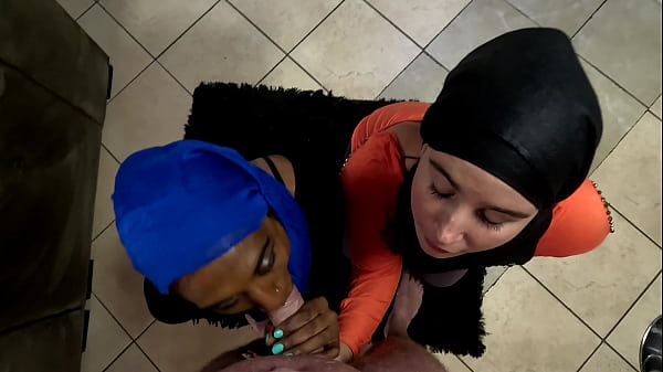 Two Muslim hijab woman on their knees sucking dick and getting their faces covered with cum